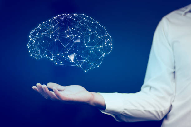 istock businessman with wire frame hand holding glow abstract brain structure 857178542