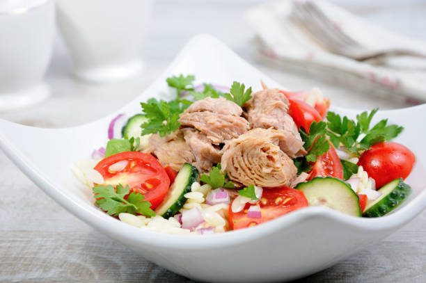 istock Salad from canned tuna with tomatoes, cucumber and orzo 857178706
