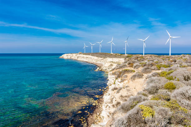 Polente Lighthouse and wind electric generators are located at western part of Bozcaada Island in Turkey.