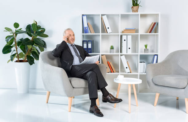istock businessman talking by phone 857193668