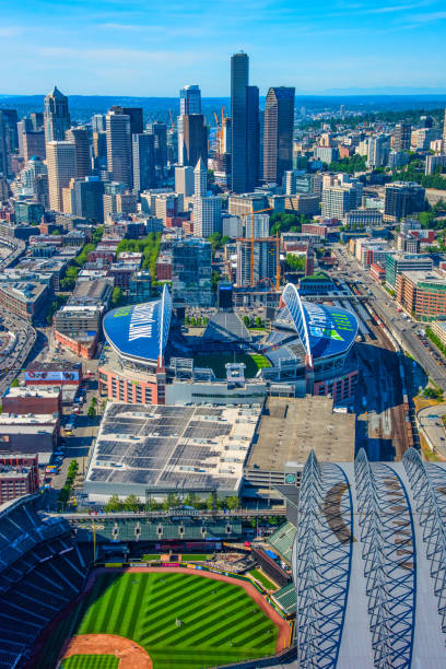Centurylink Field Seattle, United States - June 6, 2016: Home of the Seattle Seahawks NFL team, Centurylink Field with Safeco Field in the foreground and downtown behind. american league baseball stock pictures, royalty-free photos & images