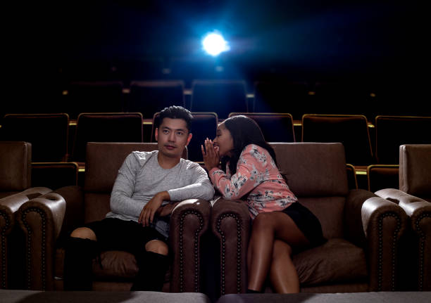 istock Whispering During a Movie Date 857198856