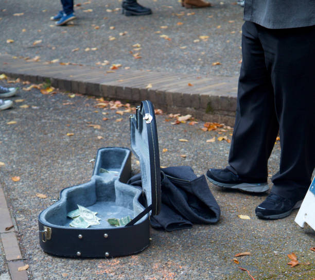 Guitarist street performer tying to earn some money