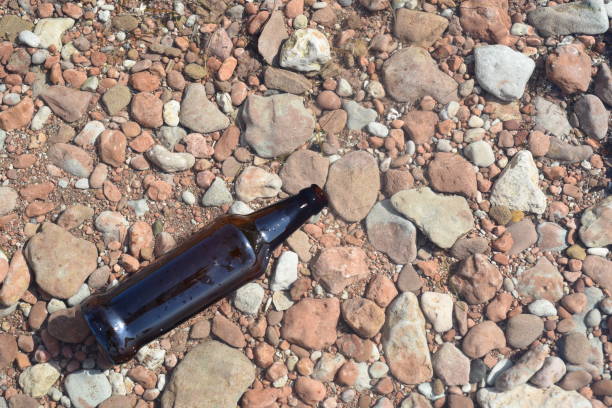 istock Brown Glass Bottle Floating in Water 857219704
