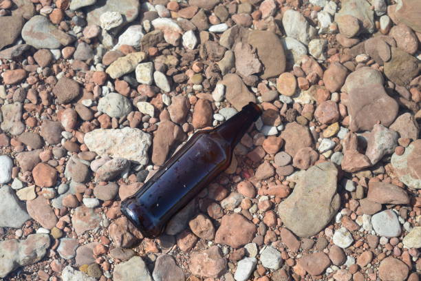 istock Brown Glass Bottle Floating in Water 857220676