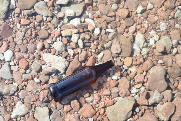 istock Brown Glass Bottle Floating in Water 857229074