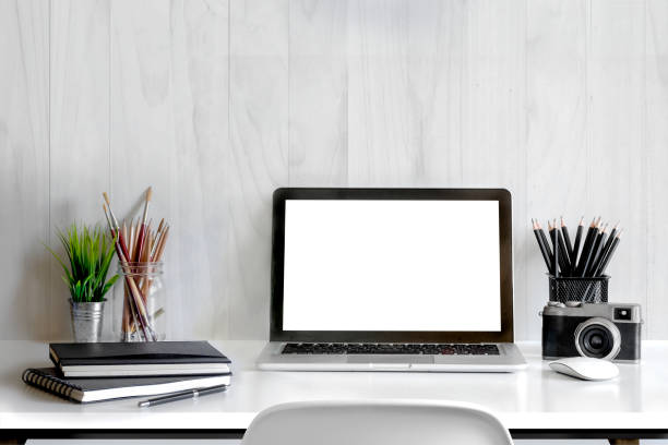 istock Laptop computer screen on white desk,working space,working background ,interior of woking room 857229398