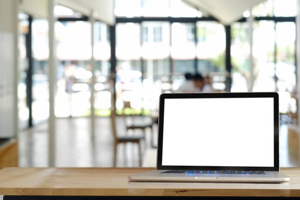 istock Laptop computer screen on wood desk,working space,working background ,interior of woking room 857229632