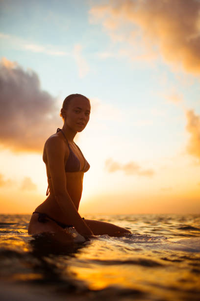 istock young surfer woman 857237514