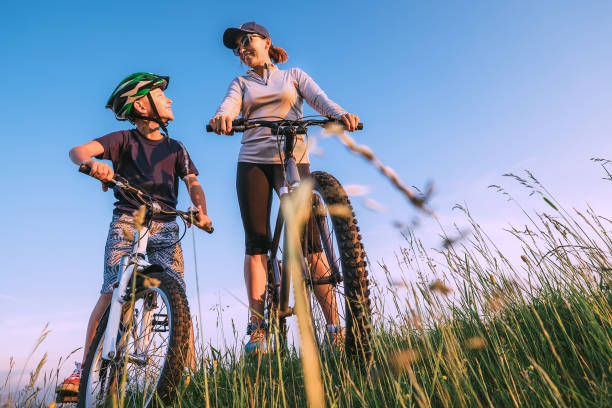 istock Mother and son ready to start to ride a bycikles 857241466