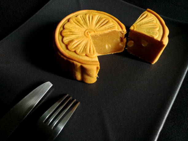 istock side view of sliced moon cakes with fork knife 857248554