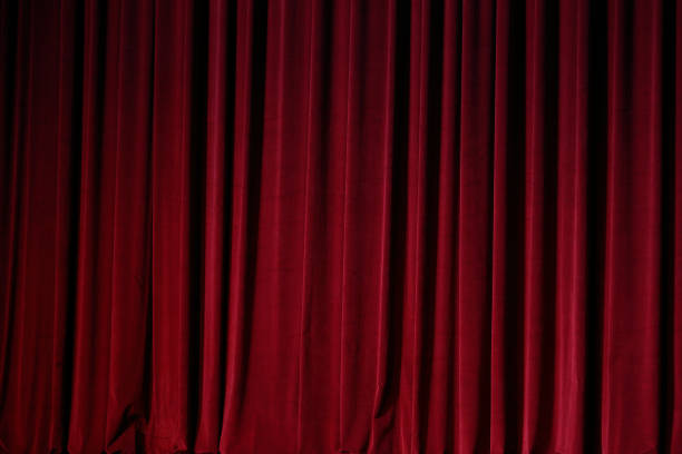 istock Red Curtain close before theatre drama begin 857252454