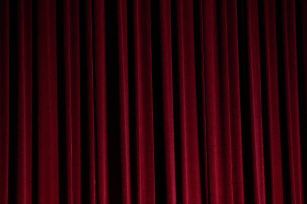 istock Red Curtain close before theatre drama begin 857252486