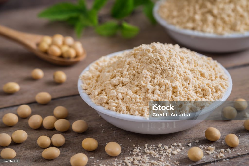 Soy flour in bowl and soybean Soybean Stock Photo