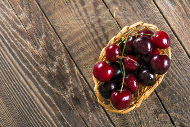 istock Ripe juicy cherry on a wooden table 857264970