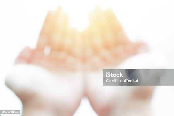 Blur Hand Open Palm On White With Magic Light Ask God Or Gift From Heaven Concept Stock Photo - Download Image Now