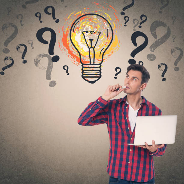 istock Man holding laptop and felt tip pen 857270758
