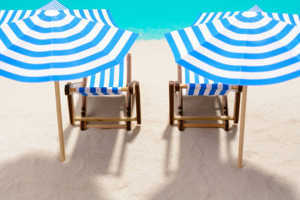 istock Beach furniture under umbrellas 857270874