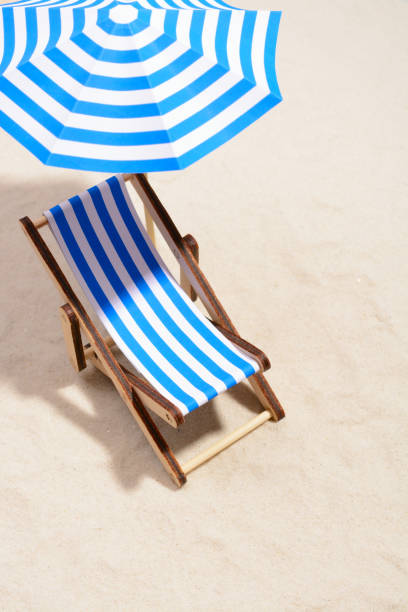 istock Beach chair and umbrella 857270918