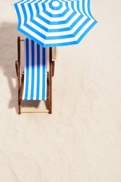 istock Beach chair and umbrella 857270922