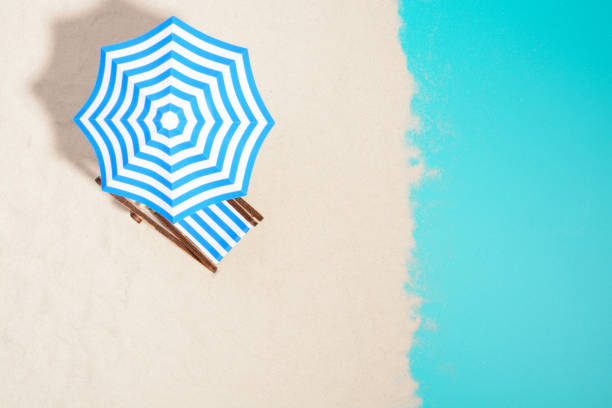 istock Beach chair and umbrella 857270954