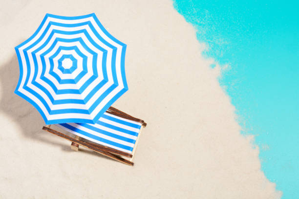 istock Beach chair and umbrella 857270970