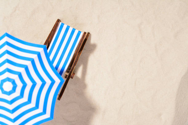 istock Beach chair and umbrella 857271204