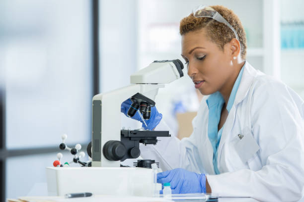 istock Female research doctor concentrates during lab experiment 857271960