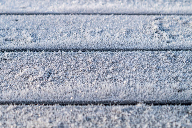 istock ice crystals on wooden background 857274404
