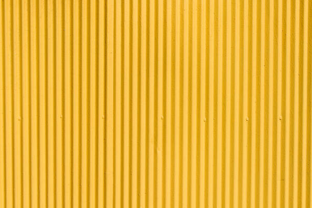 istock Yellow corrugated metal sheet background 857274584