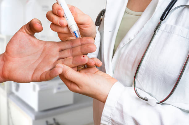 istock Measuring blood sugar on finger - diabetes concept 857282054