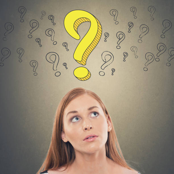 istock Thoughtful businesswoman looking up at question mark 857285336