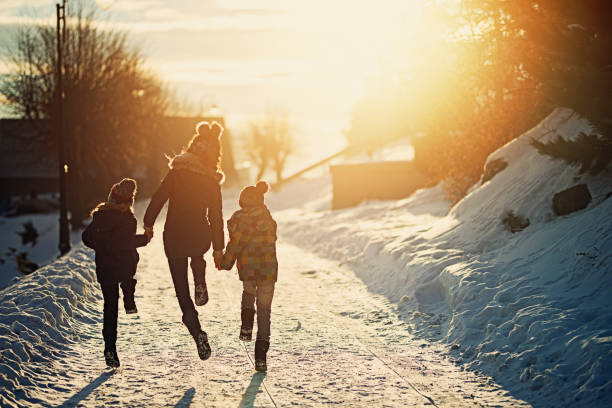 kids enjoying winter - family winter walking fun imagens e fotografias de stock