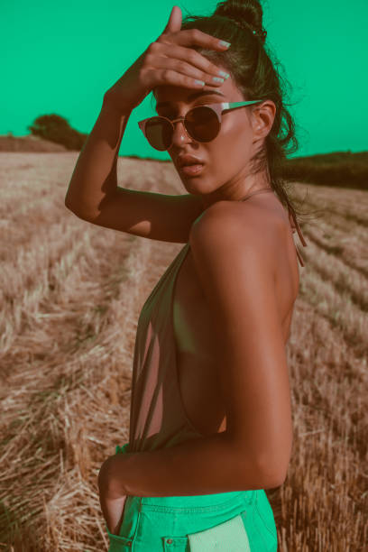 Photo of a young woman who enjoys to spend sunny summer days in nature // surreal photographic effects