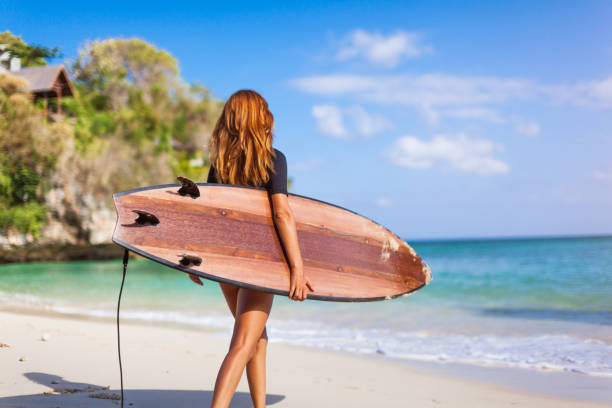 istock surfer girl 857285650
