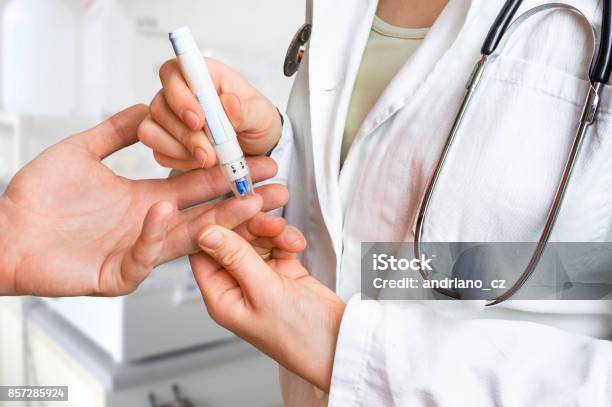 Measuring Blood Sugar On Finger Diabetes Concept Stock Photo - Download Image Now - Diabetes, Blood Sugar Test, Doctor