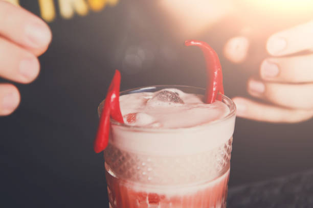 istock Creative spicy cocktail at bar background 857288890