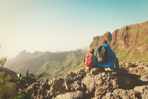 istock father and son hiking in scenic mountains 857289234