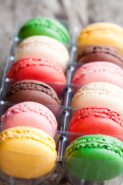 istock colorful  macarons on rustic wooden backrgound 857292490