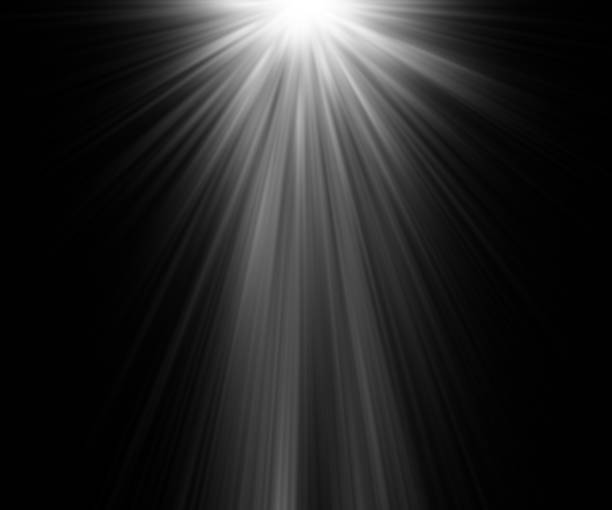 istock abstract beautiful rays of light on black background. 857300582