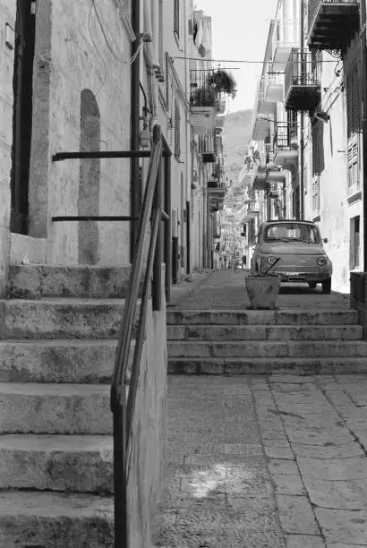 A truly classic car (old Fiat Cinquecento) is parked in Alcamo, Sicily