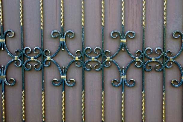 istock fragment of a fence with forged bars and a beautiful pattern 857304002