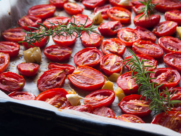 istock Red heirloom tomatoes baked with garlic 857304982