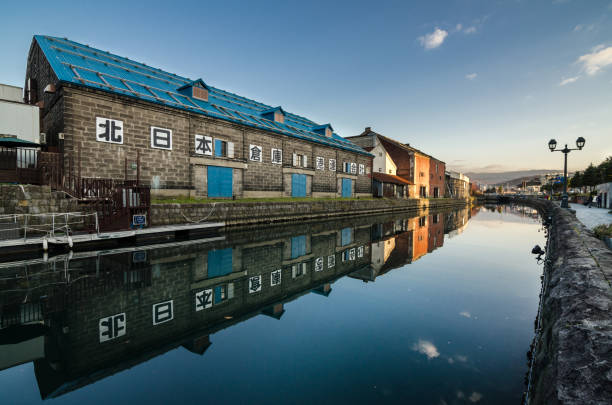 Otaru, Japan- 13 NOV 2015: Otaru Canal was once a central part of the city's busy port in the first half of the 20th century. Now, fanked by restaurants, shops & vendors, this historic canal has a romantic, old-timey ambiance.