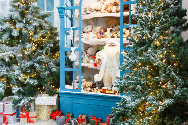 istock Christmas is coming. Decorated fir trees and presents background 857308570
