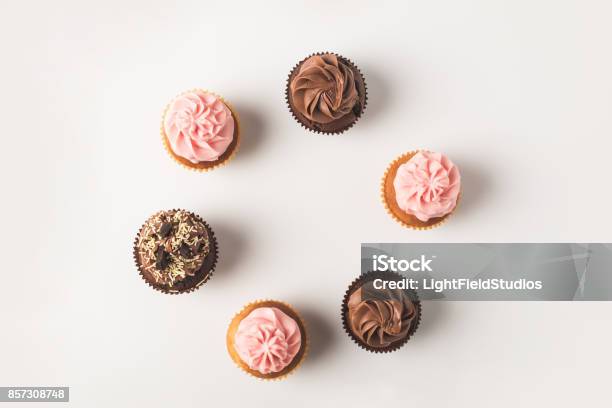 Cupcakes With Frosting Stock Photo - Download Image Now - Cupcake, High Angle View, White Background