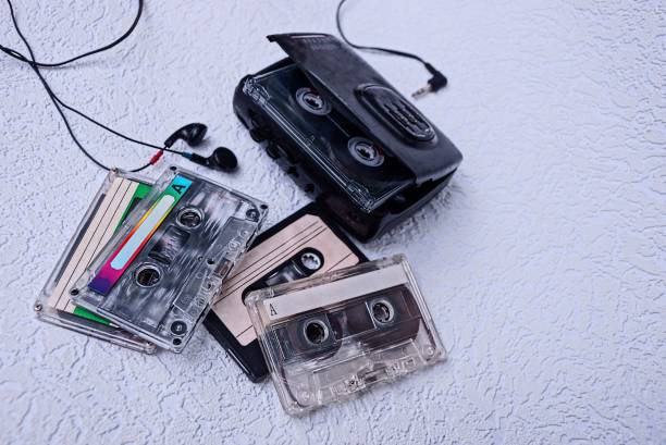 istock a set of color cassettes and a black player on the table 857308882