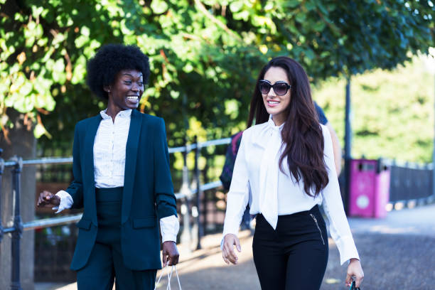 istock Walking with a friend in the park after work. 857309036