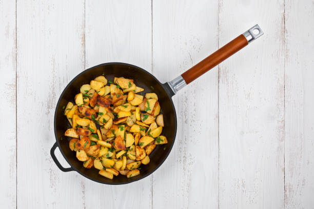 Potatoes In A Frying Pan stock photo