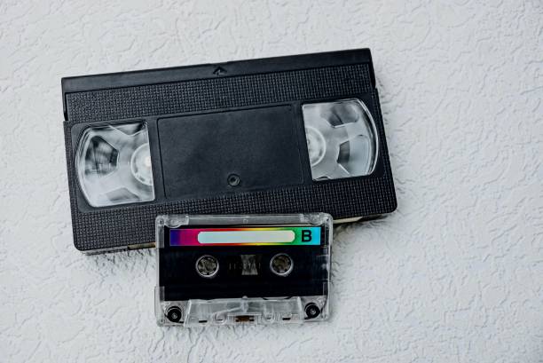 istock cassette audio and black video cassette on a gray table 857312112